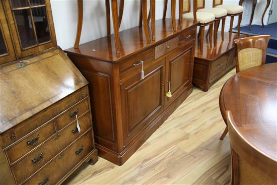 A 20th century French cherrywood radially extending dining table, the circular table extends to 6ft 7in.